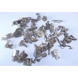 SILVER CHARMS. Forty silver charms, 89g