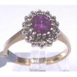 9 CT RING. 9 ct gold ruby and diamond cl