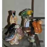 Beswick: birds comprising parrot no. 930, stonechat, chaffinch, wren, nuthatch, owl; Beatrix