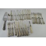 A part set of silver handled fruit knives and forks with EPNS blades: four tea knives; a silver