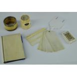 A collection of 19th century ivory and bone including an ivory card case, a salt with a silver