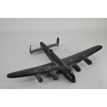 A Bakalite model of a Lancaster bomber, 29cm long, 43cm wingspan, the reverse moulded "Lancaster 1"