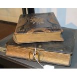 A Victorian leather cabinet card album with printed leaves; a Victorian embossed leather carte-de-