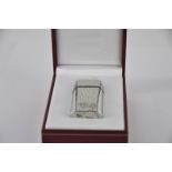 A Cartier cigarette lighter, serial no 204399, with original purchase certicate and guarantee (dated