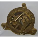 A brass combined compass and sun dial, with three adjustable feet, marked West, London, the dial 9cm