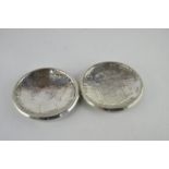 A pair of white metal coin dishes, hallmarks 915 standard, post 1934.