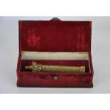 A brass scroll holder with crown finial, inscribed 'Metropolitan Police, Whitechapel, No.10', in