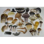 A collection of vintage and modern hair slides, mostly faux tortoiseshell, including one silver,