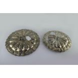 *Two Turkish Ottoman mirrors, the backs with a raised birds in the centre of repousse and flower