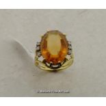 Citrine dress ring, large oval cut citrine with three single cut diamonds either side, claw set in