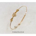 Seed pearl bangle, seed pearls set in a heart design in yellow metal tested as 18ct, mounted on an