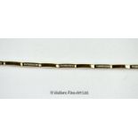 *Diamond set line bracelet, alternate bars set with diamonds in yellow metal stamped 9ct,