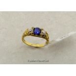 Sapphire and diamond three stone ring, central cushion cut sapphire with an old cut diamond either