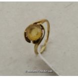 Citrine dress ring, round cut citrine in a yellow metal twist setting, tested as 14ct, ring size O½