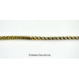 *Diamond set line bracelet, forty-four round brilliant cut diamonds mounted in yellow metal