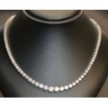 Diamond riviere necklace, one hundred and thirteen round brilliant cut diamonds claw set in white