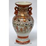 A late 19th Century Satsuma twin-handled baluster vase decorated with scenes of figures in a