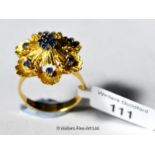 Dress ring in yellow metal stamped as 18ct, set with sapphires, gross weight 7.4 grams, ring size O