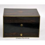 A coromandel brass bound dressing box, with internal mirror, secret leather and moire lined