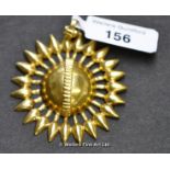 Sunburst pendant in yellow metal tested as 18ct, diameter 35mm, weight 6.3 grams