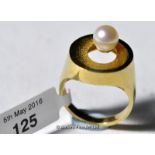 Pearl dress ring, a yellow metal ring stamped as 14ct set with a single cultured pearl, ring size N