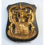 A bronze coat-of-arms for the Sinclair family, mounted on an oak shield with strut support