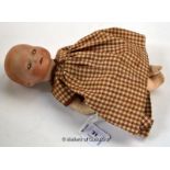 An Armand Marseille bisque head doll stamped Germany 341/O.K. AM, 25cm