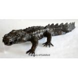 Metal garden ornament modelled as a small crocodile, 64cm long.