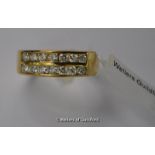 Diamond half eternity ring, two rows of round brilliant cut diamonds channel set in 18ct yellow