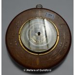 *An inlaid mahogany circular aneroid barometer. (Lot subject to VAT)