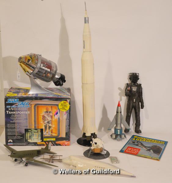 A collection of pre-made scale models and toys: the Apollo Spacecraft, Apollo Saturn V Rocket,