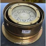 A brass gimballed compass, the dial signed Captain OM Watts Ltd, London W1, 21.5cm diameter