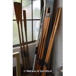 Six pairs of wooden oars.