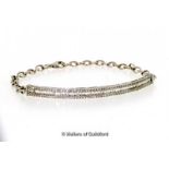 Diamond set bracelet, a curved section mounted with baguette cut diamonds and a row of round