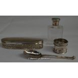 A plain glass scent bottle with green enamel and silver lid, London 1930; a cut glass oval pin box