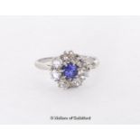 Sapphire and diamond cluster ring, central round cut sapphire with a surround of old cut diamonds,