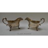 A pair of silver sauce boats with acanthus leaf knees and feet, monogrammed, London 1924/25, 685g.