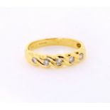 18ct yellow gold half eternity ring, round brilliant cut diamonds in a set in a twist design,