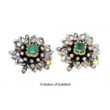 Pair of emerald and diamond cluster earrings, central rectangular emerald in a floral design, with