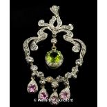 Peridot, pink tourmaline and diamond pendant, diamond set scroll design with round cut peridot