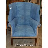 *A 19th Century wing back armchair on tapering square legs (Lot subject to VAT)