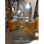 A burr walnut kidney shaped dressing table with an arrangement of five drawers on cabriole legs,