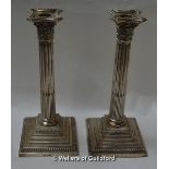 A pair of silver Corinthian column candlesticks with stepped bases, Harrison Brothers & Howson,