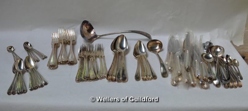 A suite of silver plated cutlery comprising twelve each of teaspoons, table and dessert forks, eight