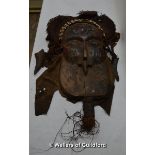 *An African tribal mask with cowrie bead head piece, carved features, canvas hair, approx 55cm. (Lot