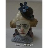 Lladro portrait bust of a sad clown with flower on his hat, separate wooden stand, 27cm.