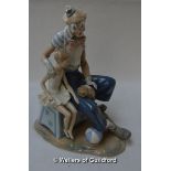 Lladro clown with concertina, seated on a pillar with a ballerina, 34cm.