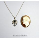 Shell cameo depicting a portrait of a man, with white metal border tested as silver, safety chain