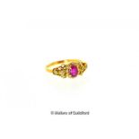 Ruby and diamond cluster ring, oval cut ruby with a surround of round brilliant cut diamonds and