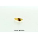 *9ct yellow gold ring set with an oval cut garnet and one small diamond, ring size H½ (Lot subject